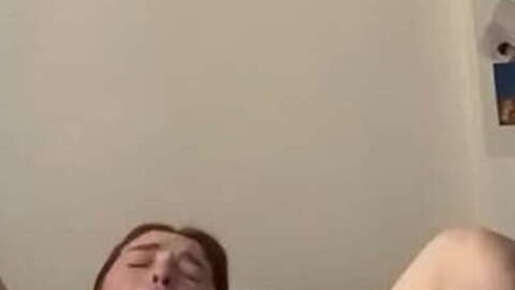 Young Teen Pleasures Herself with Toy on Bed