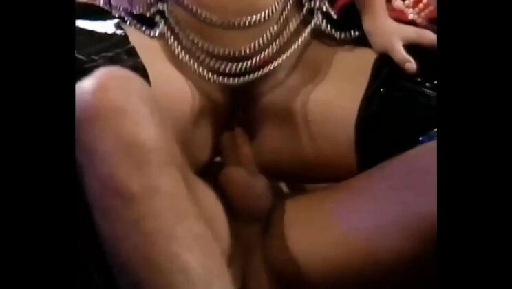 Rocco Siffredi's big dick drilling a sexy blonde milf in a classic retro scene
