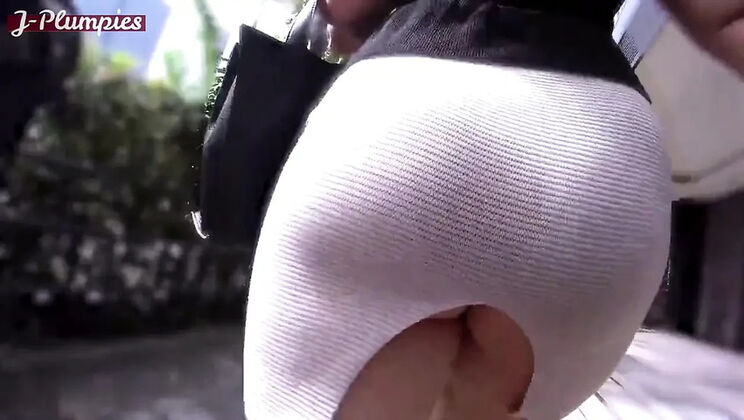 Asian angel lifts her tight skirt outdoors until everything is boldly shown