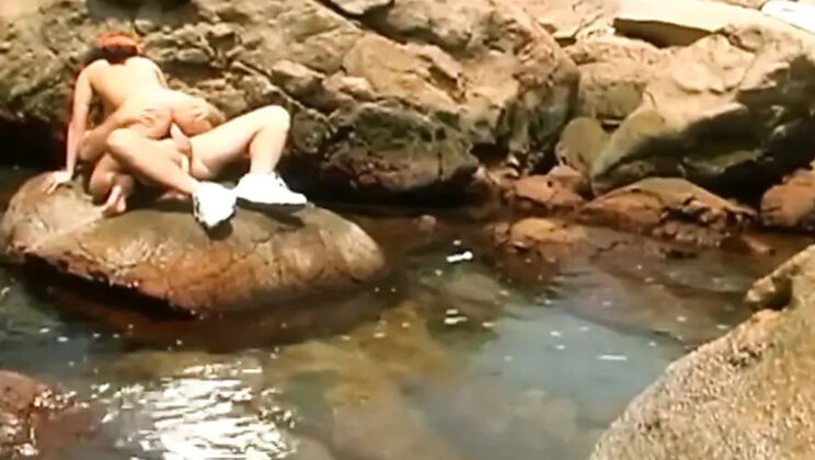 Amateur Brunette in Orange Cap Solo Striptease on Rocks by Natural Pool