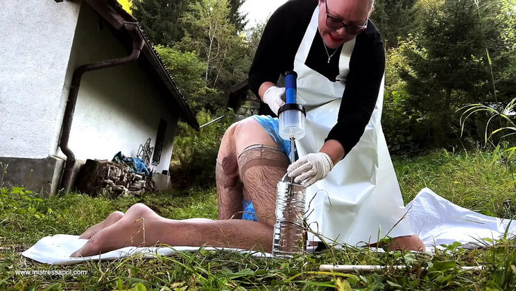 Dominatrix Mistress April outdoor bondage enema slave gets ass punishment